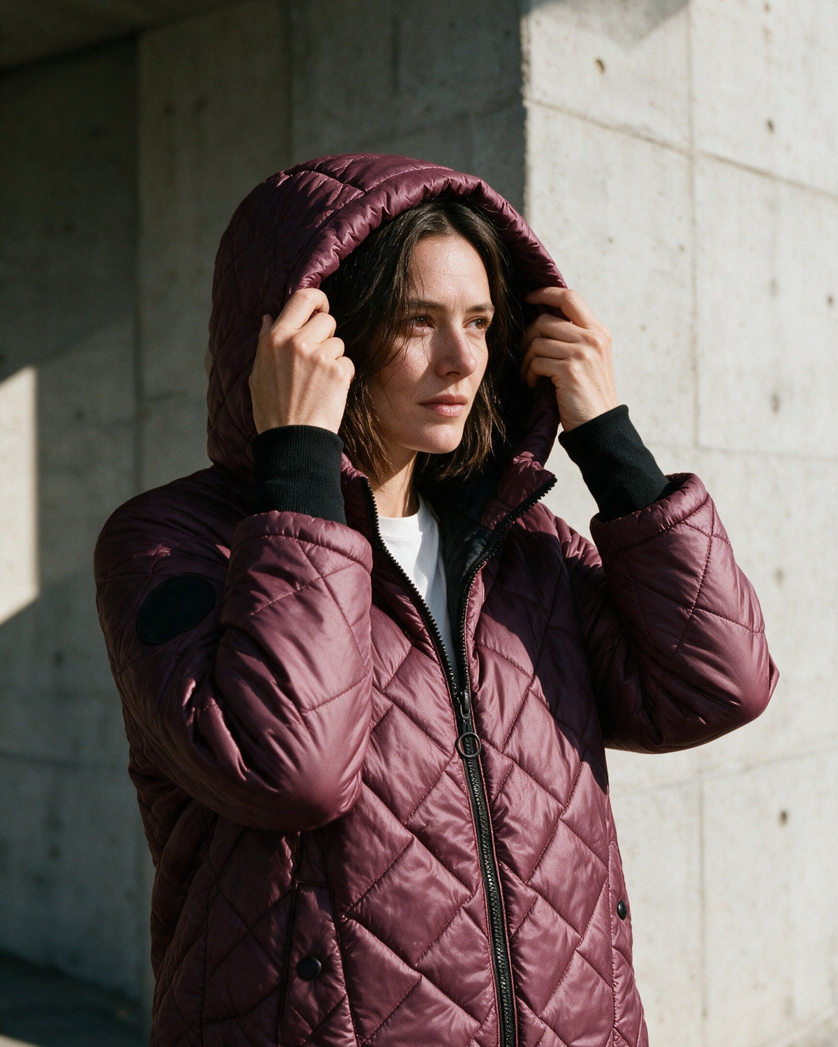 Ainsley puffer jacket in Burgundy with the hood up
