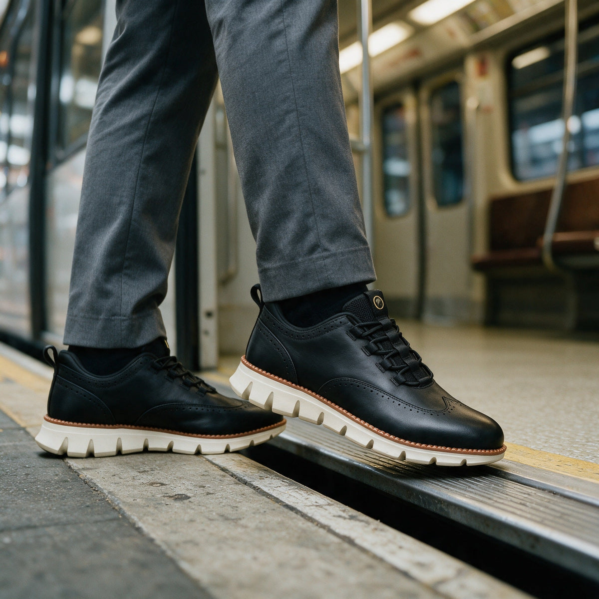 Pemberton wingtip sneaker in Black, worn on the commute