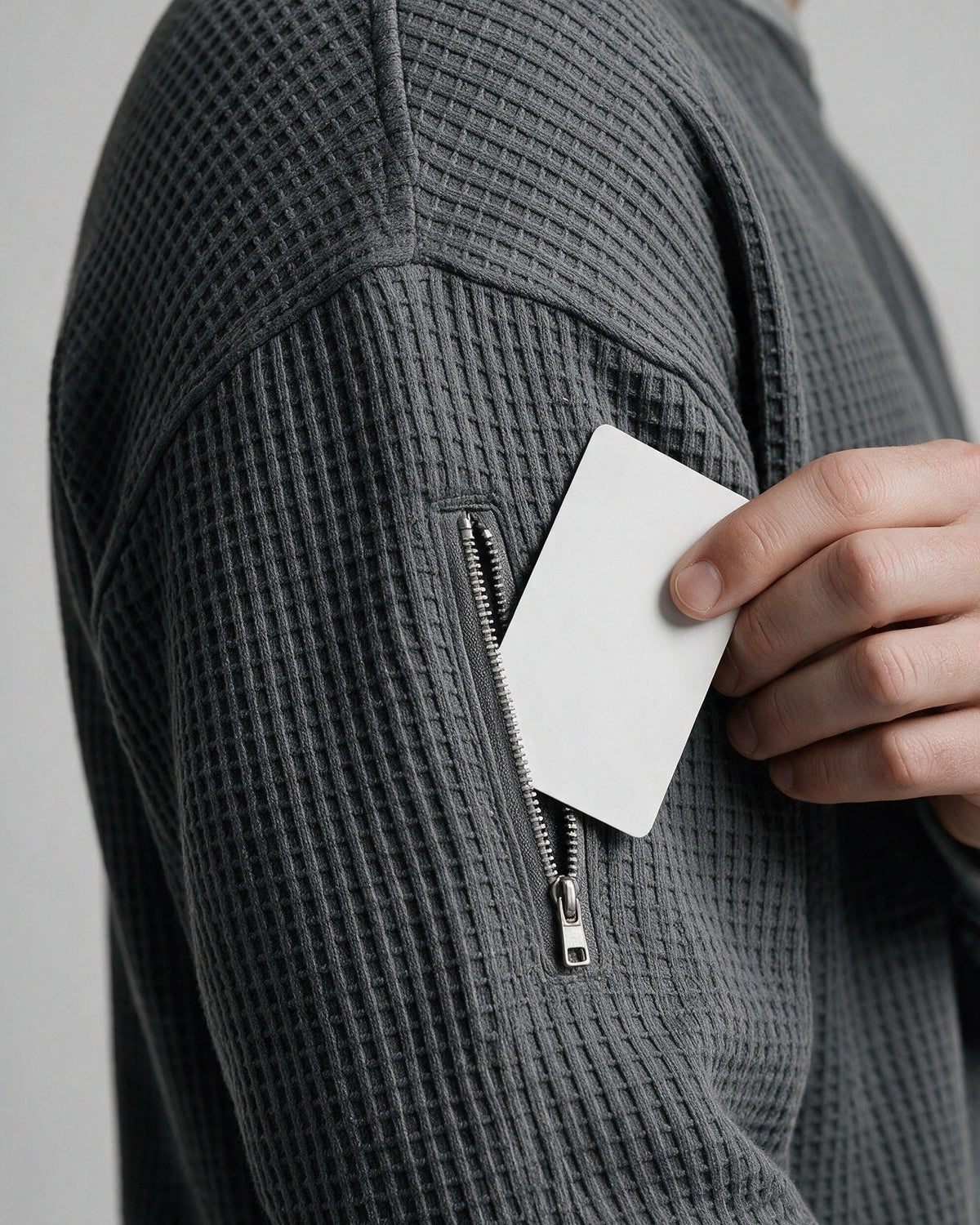 Selby sleeve zip pocket, close-up