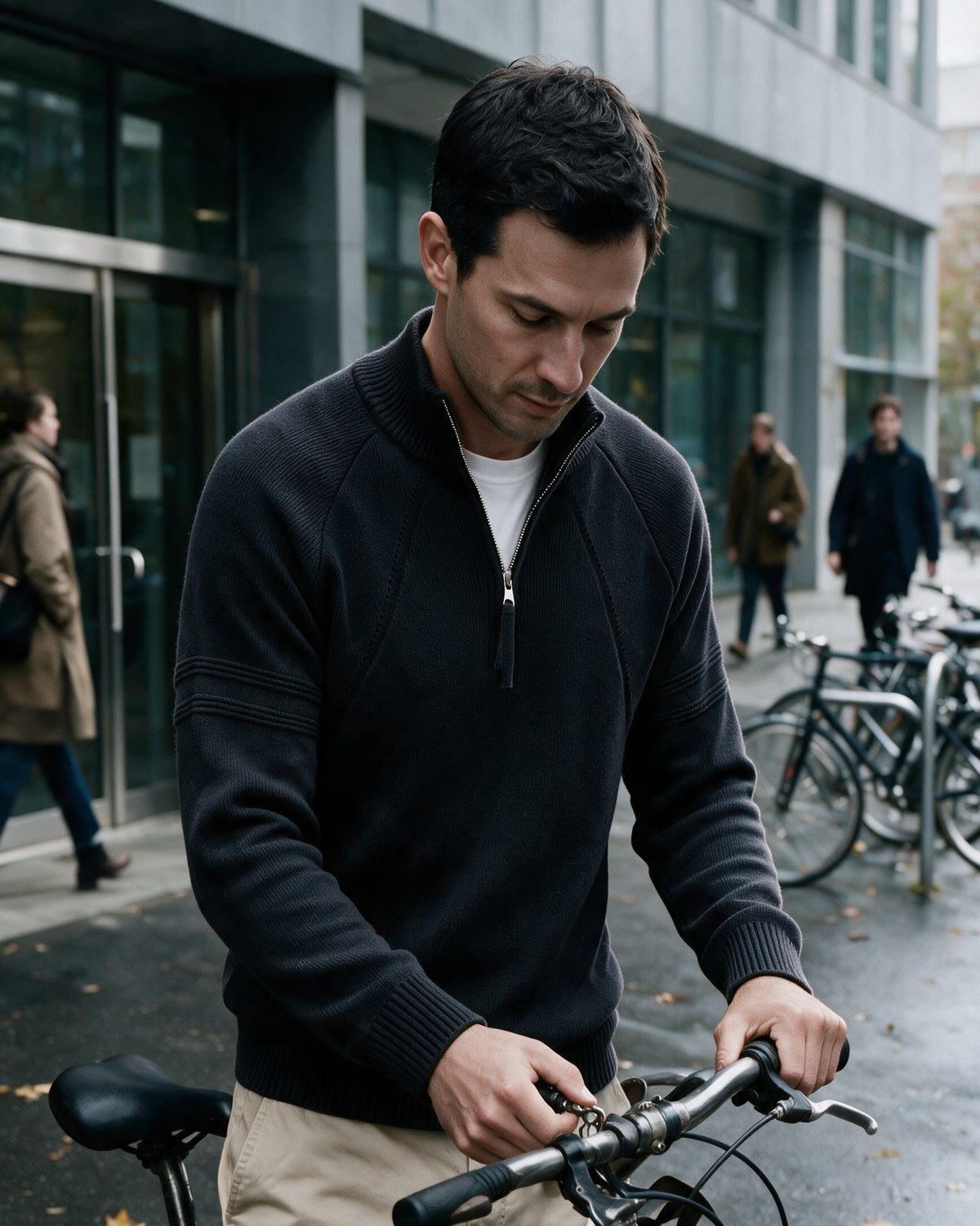 Alder quarter-zip pullover in Black, worn in the city
