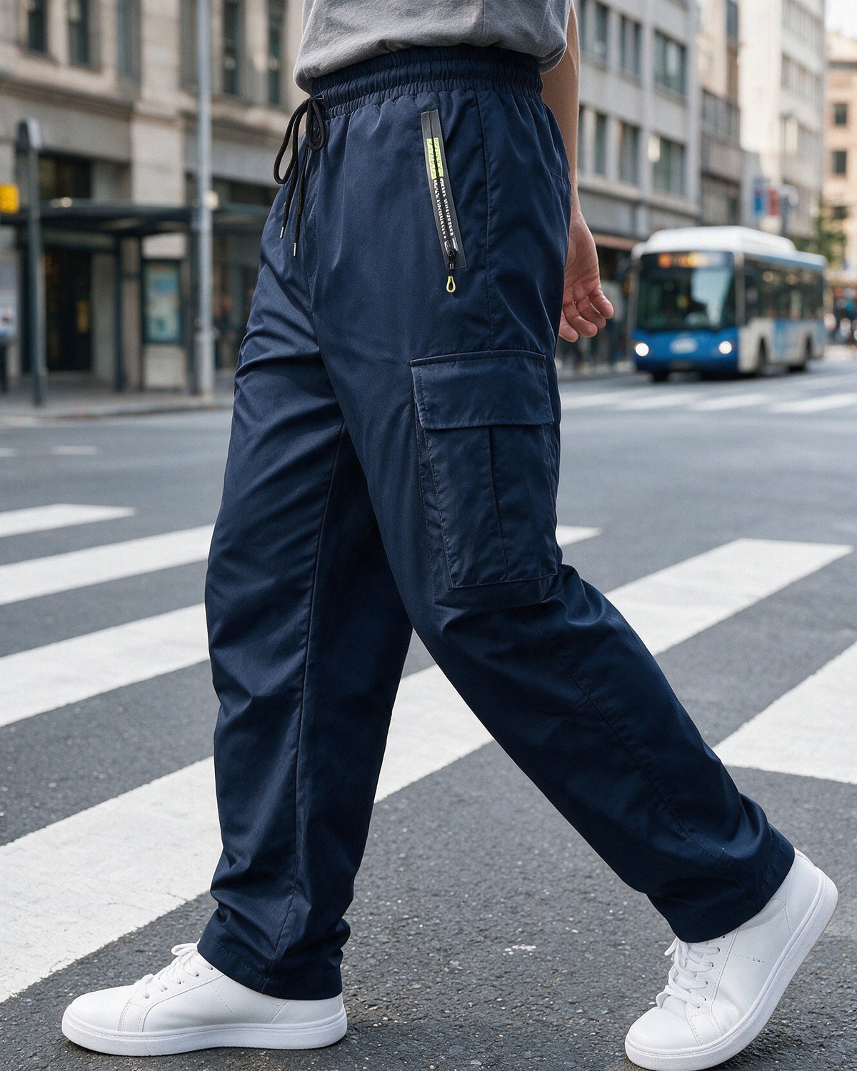Hartley cargo trousers in Navy Blue on a city crossing