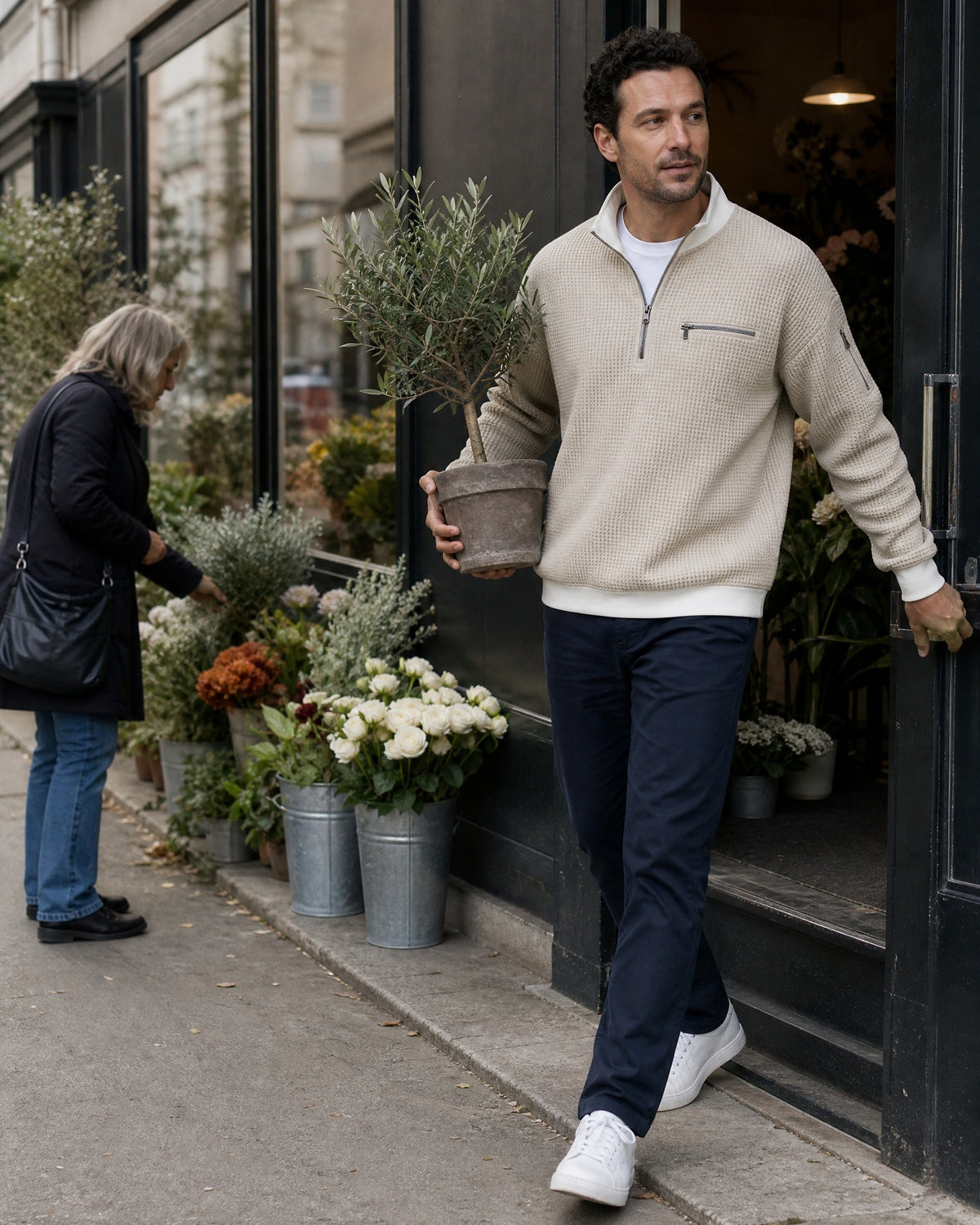 Selby half-zip pullover in Beige, worn leaving a flower shop